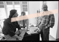 Original photographic negative of writers Joan Manuel Tresserras, Víctor Batallé, and Enric Marín meeting in an office, Premis Octubre Valencia 1994, 35mm film, rare.
