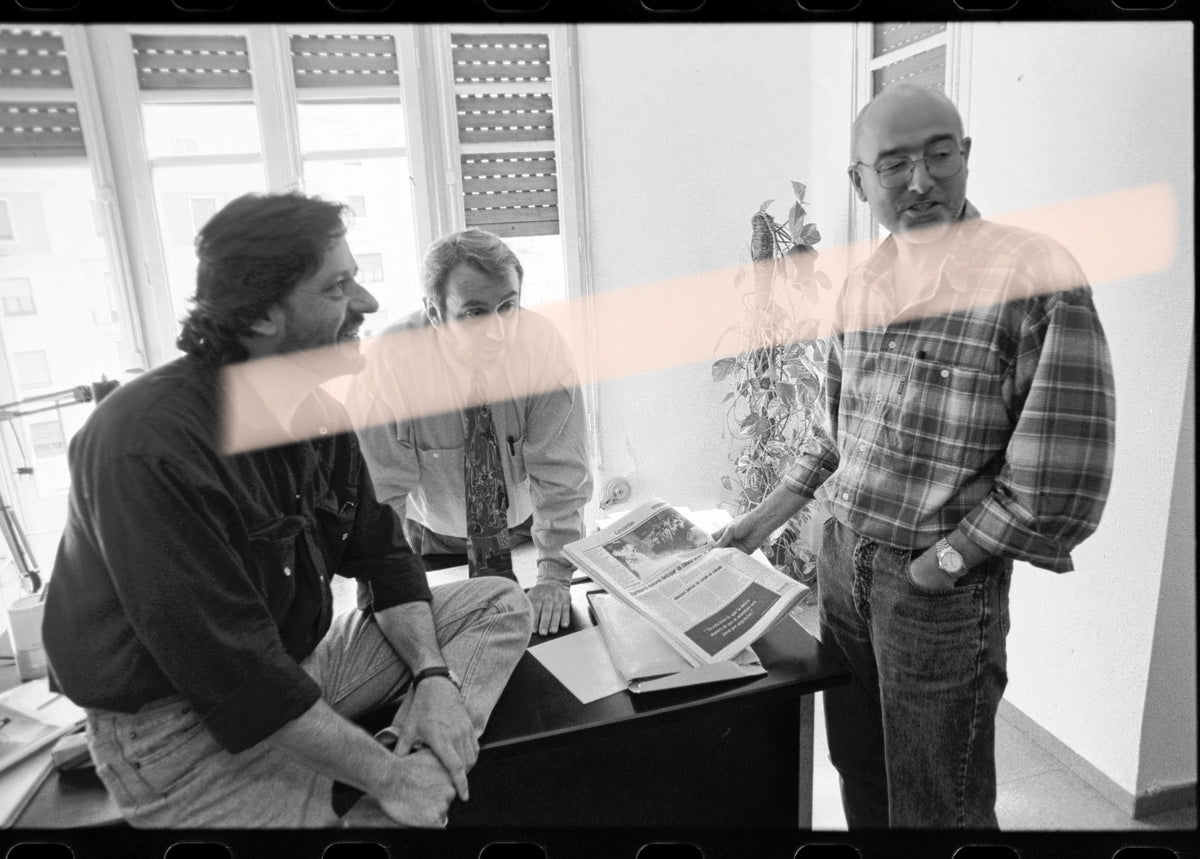 Original photographic negative of writers Joan Manuel Tresserras, Víctor Batallé, and Enric Marín meeting in an office, Premis Octubre Valencia 1994, 35mm film, rare.