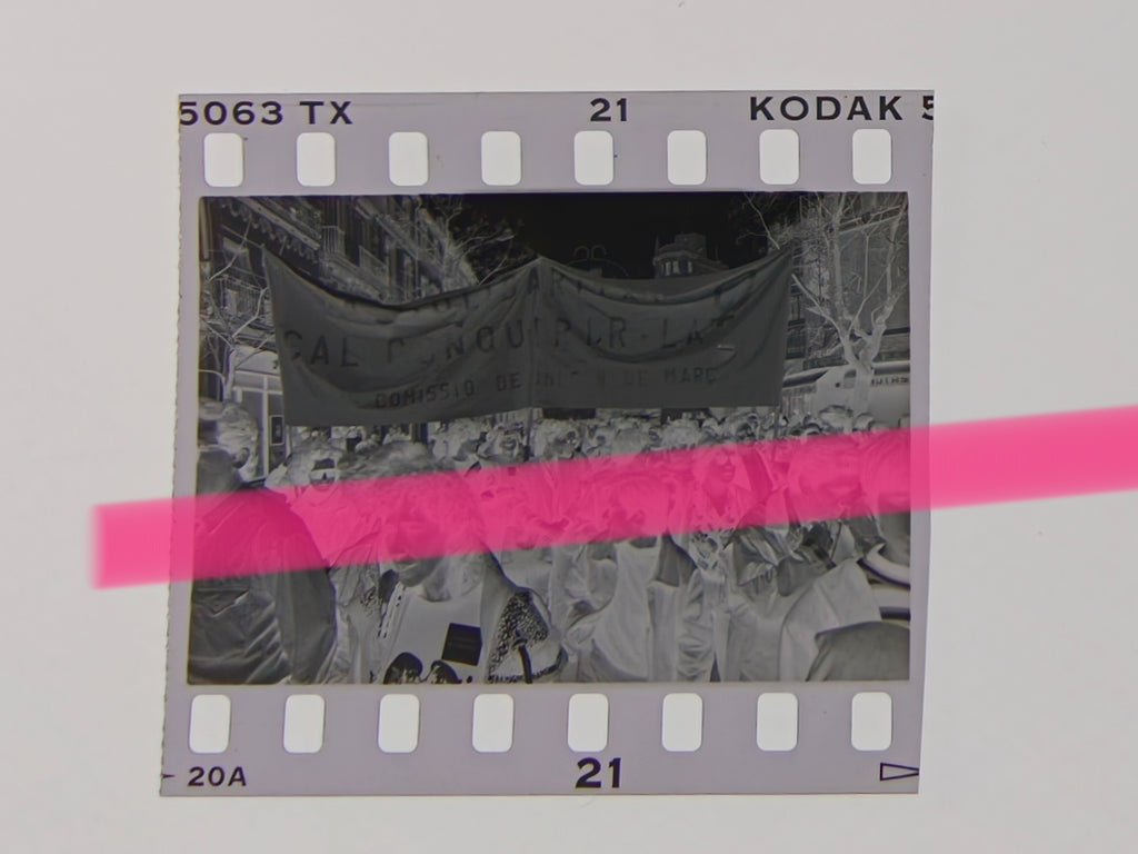 Original photographic negative of a feminist demonstration, crowd under a Comissió de Dones 8 de Març banner, Valencia 1992, 35mm film, Rare