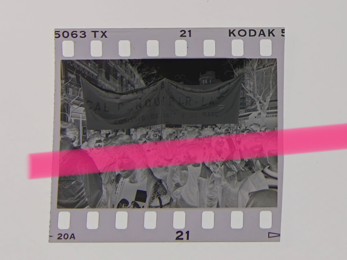 Original photographic negative of a feminist demonstration, crowd under a Comissió de Dones 8 de Març banner, Valencia 1992, 35mm film, Rare