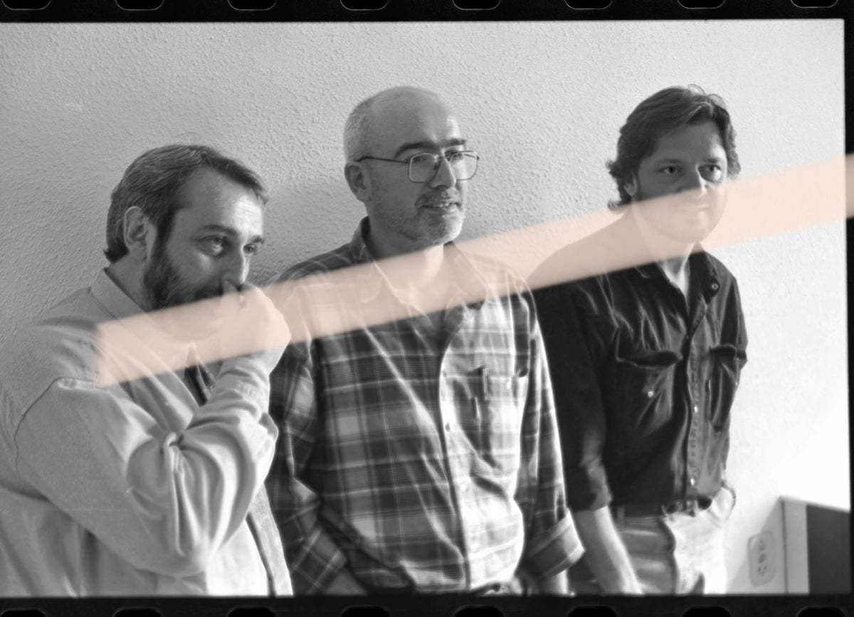 Original photographic negative of writers Víctor Batallé, Enric Marín, and Joan Manuel Tresserras, winners of the 1994 Premis Octubre in Valencia, 35mm film, Rare.