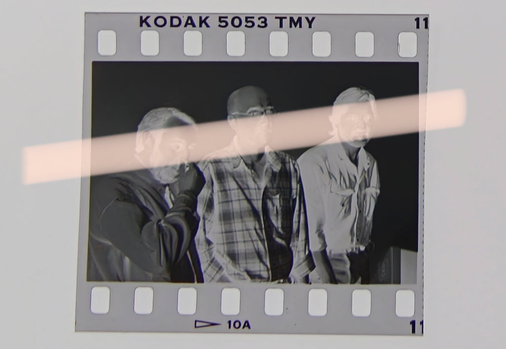 Original photographic negative of writers Víctor Batallé, Enric Marín, and Joan Manuel Tresserras, winners of the 1994 Premis Octubre in Valencia, 35mm film, Rare.