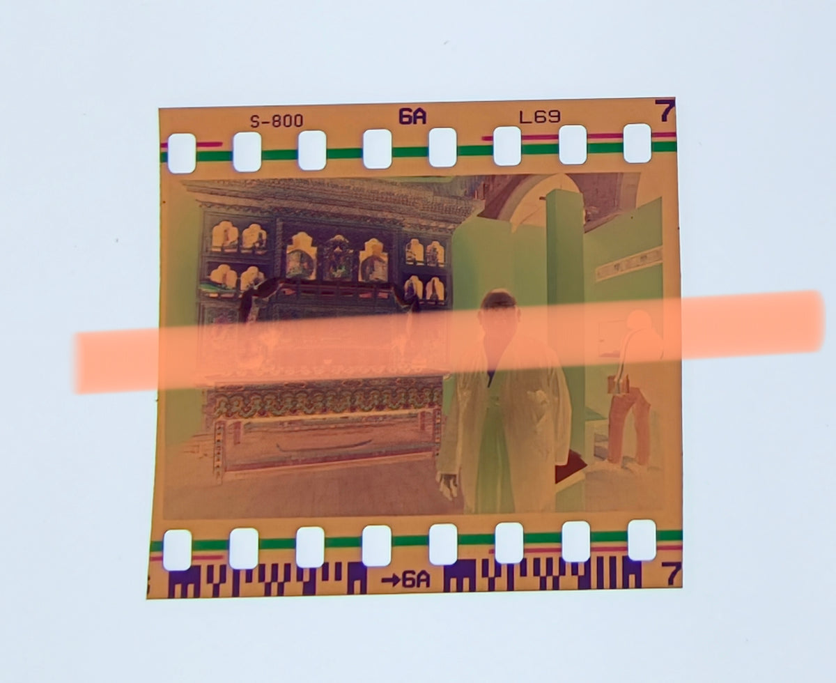 Original photographic negative depicting a Bhutanese representative next to an altar, Bhutan exhibition, L'Almodí, Valencia, 1999, 35mm film. Rare.