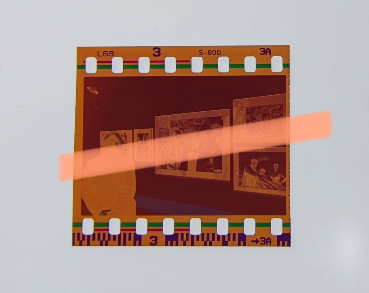 Original photographic negative of a visitor in front of photographs by Ernest Hemingway, Valencia exhibition 1999 35mm film Rare